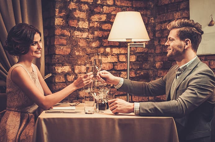 A couple is toasting with champagne